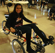 Mini propels a specialized tricycle on the VA field trip