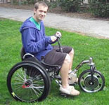 Testing an electric motor hybrid drive for a 3-wheeled lever-drive wheelchair (2011)